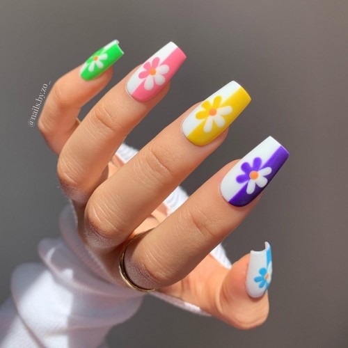 colorful nails with floral accent nails, floral painted colorful nails, summer nails 2021, bright summer nails 2021, summer nail trends 2021, summer nail art, summer nail polish designs, short summer nails 2021, cute summer nails 2021, short summer nails 2021, best summer nail colors 2021