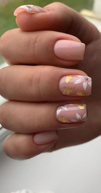 Nude nails with flower & gold leaf accent nails