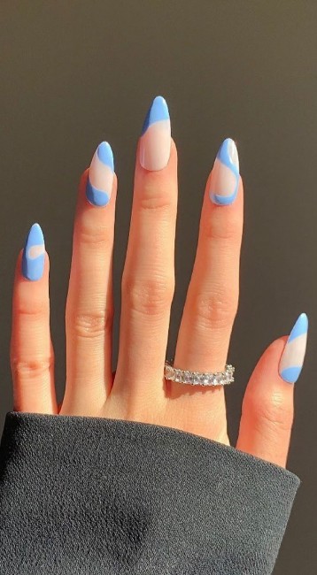 blue french tips, blue french manicure, wavy negative space nails, negative space nails, almond-shaped nails, nude nail art design, blue tip nails