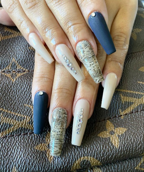 Matte blue nail polish and Snakeskin print nails