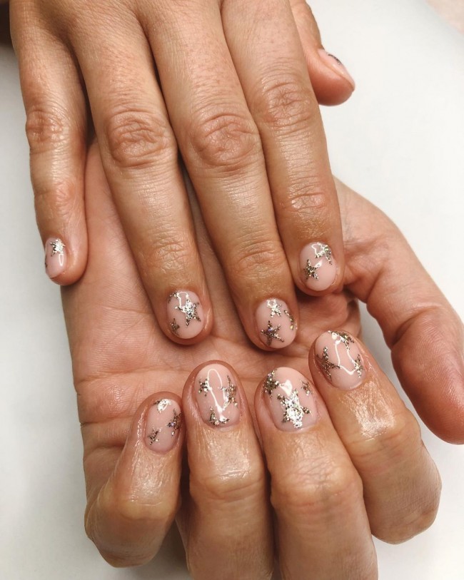 glitter star nude nails, nude nails with glitter, nude nail designs 2021, nude and white nail designs, short nude nails, neutral color nail designs, long nude nails, neutral nail designs 2021, nude acrylic nails, nude and silver nails, nude nails with diamonds, nude nails with design, beige nails with glitter