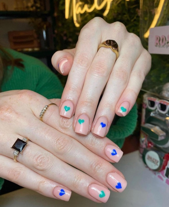 72 Cutest Valentine’s Day Manicure Ideas — Minimalist Nude Nails with Blue and Green Hearts