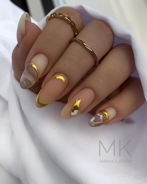 nude nails with gold and marble, matte nude nails, nude nails 2022, nude nails with design, nude acrylic nails, nude gel nails, short nude nails, nude nails design, nude nails with gold lines