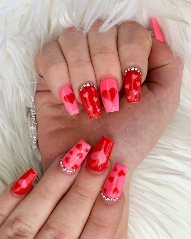 Valentine’s Day Nail Art Designs 2022 : Mismatched Pink and Red Nails with Love Hearts