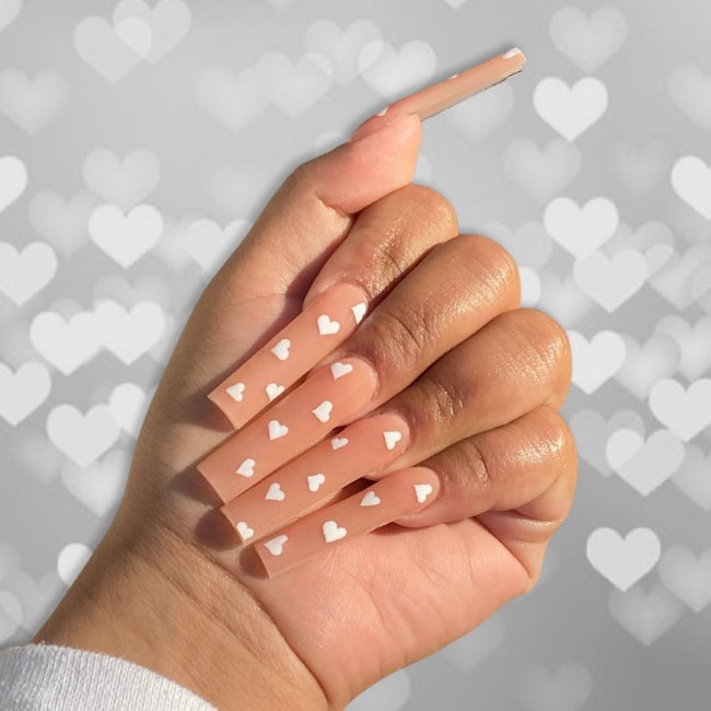 nude nail white hearts, valentine’s day nails, heart nails, valentine’s day nails 2022, pink nails 2022, love heart nails, heart tip nails, simple heart design nails, acrylic nails with hearts