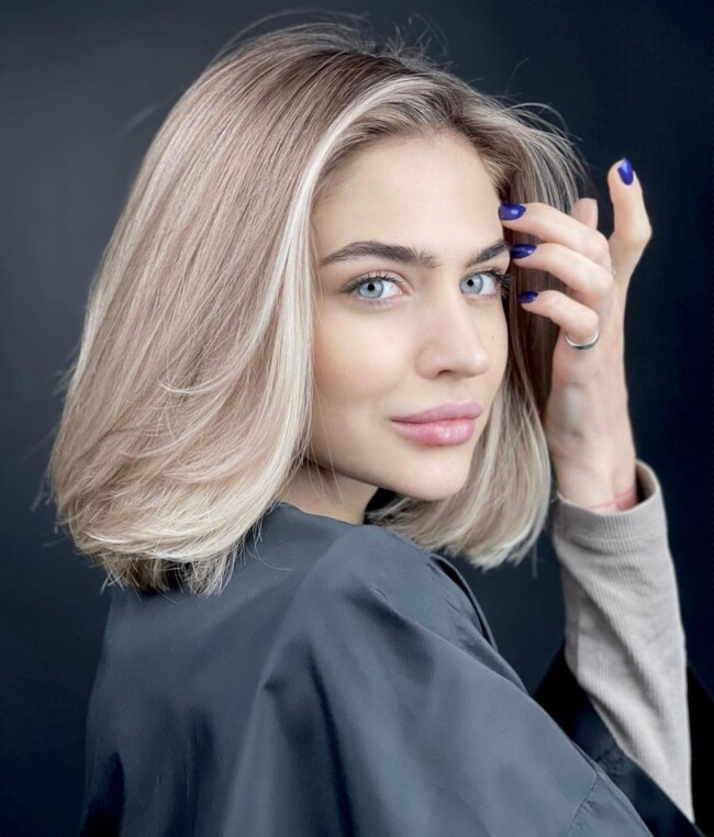 50 Best Bob and Lob Haircuts for Summer 2022 — Pearl Blonde Side Part Long Bob Hairstyle