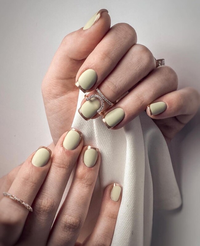 35 Modern Simple French Tip Nails — Light Green Nails with Gold Tips