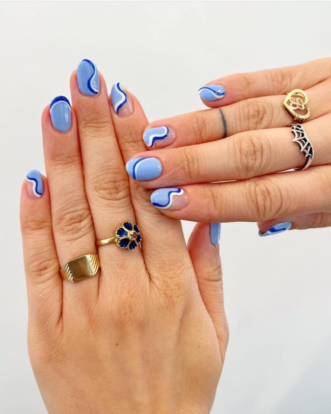 70 Pretty Nails That Are Appropriate To Wear in Summer — Blue and White Swirl Blue Nails