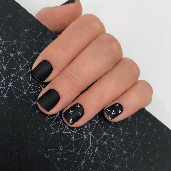 60+ Charming Black Nail Ideas — Tiny White Leaf Black Nails