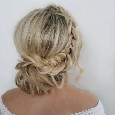 Soft low boho braided bun bridal hairstyle with effect braid
