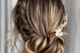Romantic crown braided bun with side braid and soft face-framing tendrils