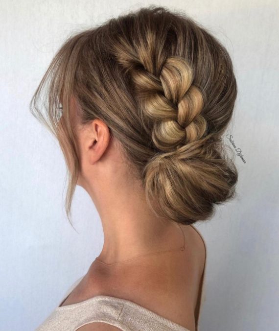 french-braided bun chignon, braided bun with weaves, braided ballerina bun, braided bun with bangs, easy braid bun hairstyles, cute braided bun hairstyles, braids with a bun on top, braided bun hairstyles for black hair, wedding hairstyle, bridal braided bun, wedding braided bun hairstyle. French braided low bun with polished side strands and soft volume