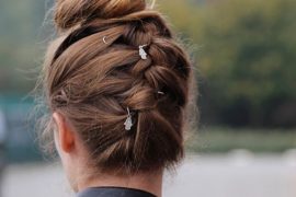 Upside down braided bun hairstyle with sleek braid and messy bun