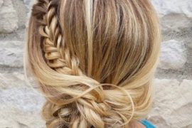 french-braided bun chignon, braided bun with weaves, braided ballerina bun, braided bun with bangs, easy braid bun hairstyles, cute braided bun hairstyles, braids with a bun on top, braided bun hairstyles for black hair, wedding hairstyle, bridal braided bun, wedding braided bun hairstyle Braided Sun Bun hairstyle featuring a loose blonde braid wrapped into a romantic low bun, perfect for summer weddings
