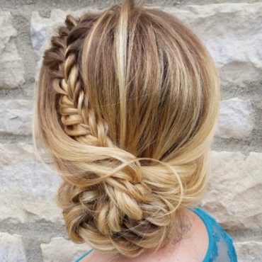french-braided bun chignon, braided bun with weaves, braided ballerina bun, braided bun with bangs, easy braid bun hairstyles, cute braided bun hairstyles, braids with a bun on top, braided bun hairstyles for black hair, wedding hairstyle, bridal braided bun, wedding braided bun hairstyle Braided Sun Bun hairstyle featuring a loose blonde braid wrapped into a romantic low bun, perfect for summer weddings