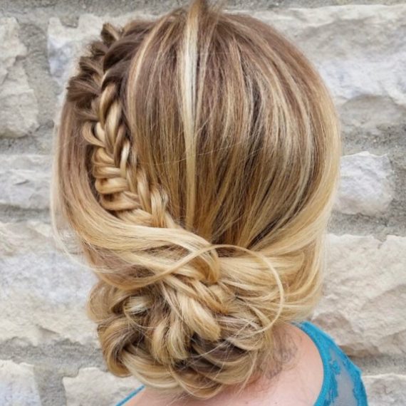 french-braided bun chignon, braided bun with weaves, braided ballerina bun, braided bun with bangs, easy braid bun hairstyles, cute braided bun hairstyles, braids with a bun on top, braided bun hairstyles for black hair, wedding hairstyle, bridal braided bun, wedding braided bun hairstyle Braided Sun Bun hairstyle featuring a loose blonde braid wrapped into a romantic low bun, perfect for summer weddings