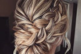 Dirty blonde braided updo with twisted low bun and soft braid detail – bridal hairstyle