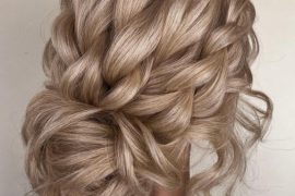 french-braided bun chignon, braided bun with weaves, braided ballerina bun, braided bun with bangs, easy braid bun hairstyles, cute braided bun hairstyles, braids with a bun on top, braided bun hairstyles for black hair, wedding hairstyle, bridal braided bun, wedding braided bun hairstyle. Voluminous braided messy bun hairstyle with soft tendrils – perfect for romantic summer brides