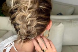 fUpside down braided bun with voluminous top knot and wide braid for bridal hair