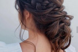 Braided low bun with crown braid and voluminous bun – romantic bridal hairstyle