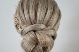 fChunky braided bun hairstyle with elegant twist and low polished bun – bridal updo