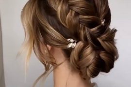 french-braided bun chignon, braided bun with weaves, braided ballerina bun, braided bun with bangs, easy braid bun hairstyles, cute braided bun hairstyles, braids with a bun on top, braided bun hairstyles for black hair, wedding hairstyle, bridal braided bun, wedding braided bun hairstyle. Braided bun hairstyle for brunette bride with soft tendrils and elegant hair clip