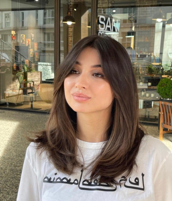 15 Flattering Round Face Haircuts in 2022 — Long Layered Haircut with Bangs
