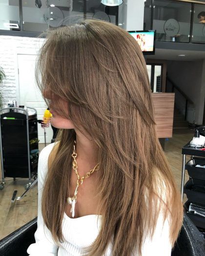 40 The Trendiest Haircuts with Curtain Bangs — Golden Brown Blonde Layers