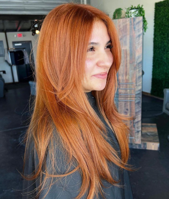 35 Best Copper Hair Color Ideas — Bright Copper Layered Cut with Curtain Bangs