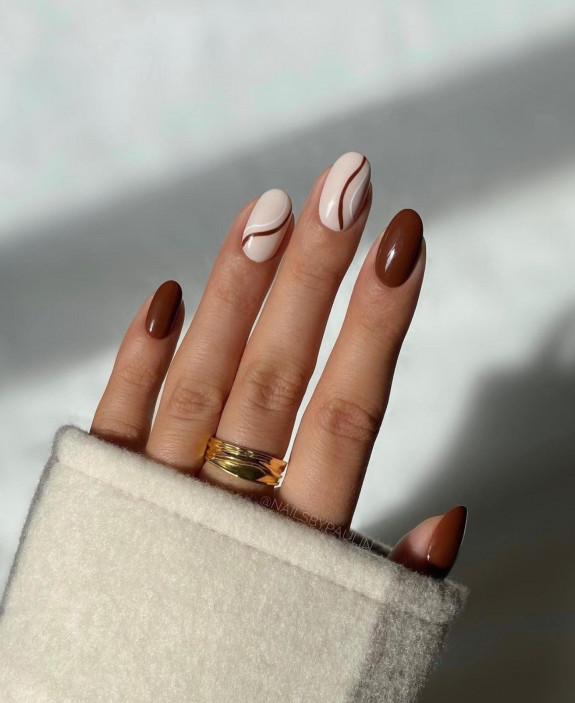 50+ Fall Nails That Are So Trendy — Chocolate and White Swirl Oval Nails