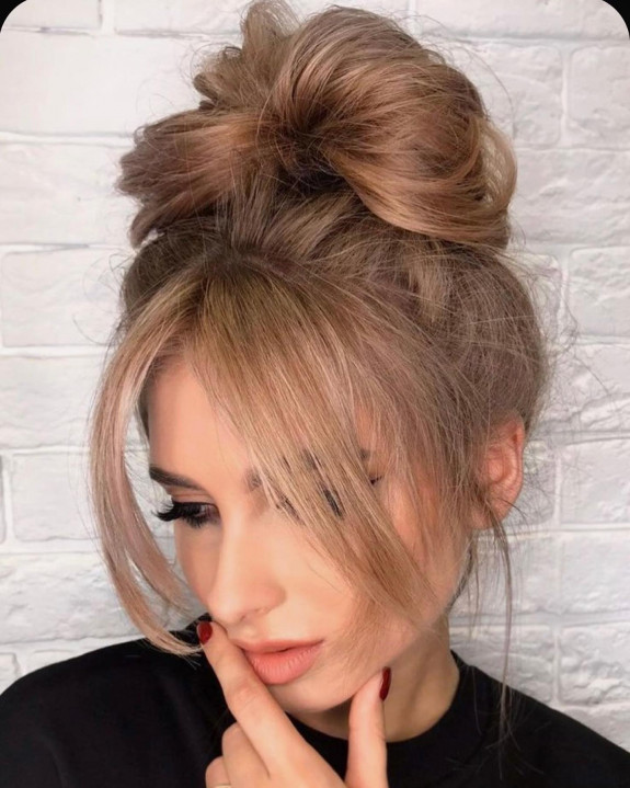 50 Cute Ways To Wear Curtain Bangs — High Bun with Bangs