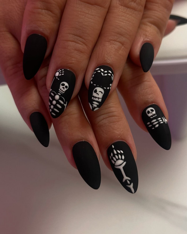 40 Hauntingly Beautiful Halloween Nail Ideas : Black Matte Nails with Deadly Skeleton Vibes 