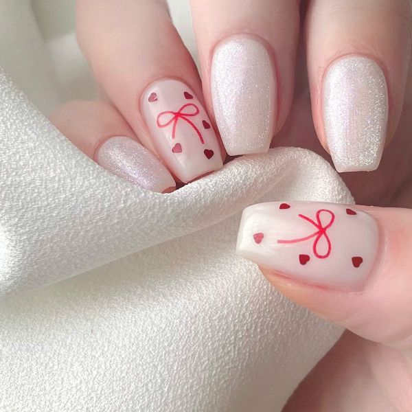 Shimmery White Valentine’s Day Nails with Red Bows & Hearts, simple valentine's day nails, Best Valentine's Day Nails ideas, Valentine's Nails, Valentine nails, Valentine's day nails, cute Valentine's nail art