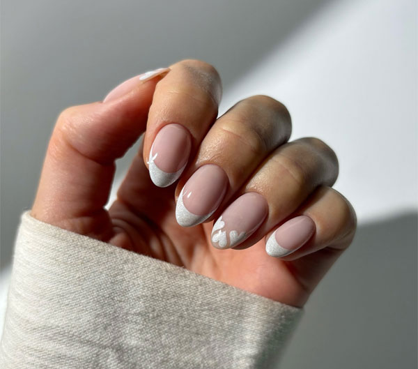 100 Best Valentine’s Day Nails ideas : Clean Girl White French Tip Nails with Heart Accents