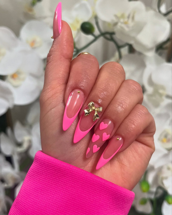 100 Best Valentine’s Day Nails ideas : Hot Pink Almond-Shaped Valentine’s Day Nails with Gold Bow