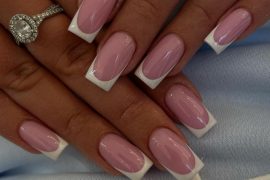 Medium-length square nails with glossy pink base and crisp white French tips
