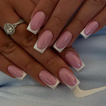 Medium-length square nails with glossy pink base and crisp white French tips