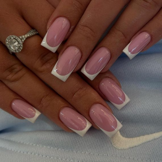 Medium-length square nails with glossy pink base and crisp white French tips