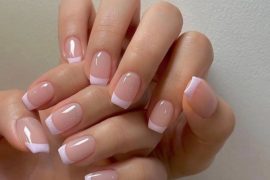 Short square-shaped nails with a nude pink base and glossy baby pink French tips