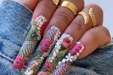 Extra-long coffin nails with tropical floral print, 3D hibiscus flowers, pearls, rhinestones, and leaf details