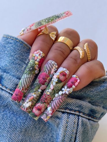 Extra-long coffin nails with tropical floral print, 3D hibiscus flowers, pearls, rhinestones, and leaf details