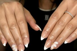 White French Tip Almond Nails with White Petal Accents