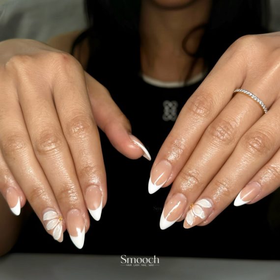White French Tip Almond Nails with White Petal Accents