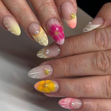 Beachy Almond Nails with 3D Flowers, Pearls, and Seaside Accents