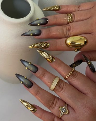 Black and Gold Sculpted Stiletto Nails for a Luxe Statement Look