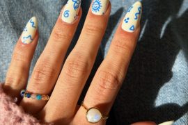 Blue Doodle on White Almond Nails for a Youthful Twist