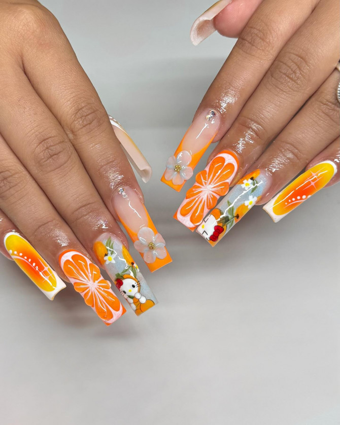 Long square acrylic nails with orange slices, white flowers, and Hello Kitty cartoon accents 