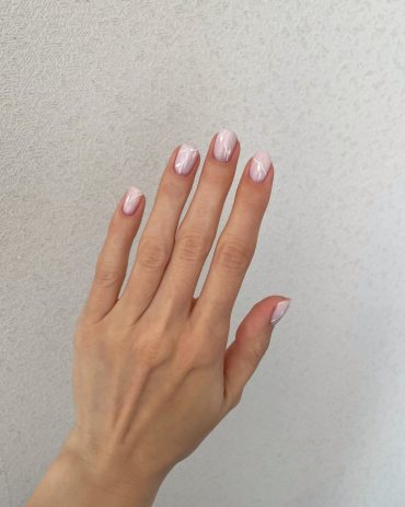 Short natural nails in blush pink with glossy finish and minimalist white line design