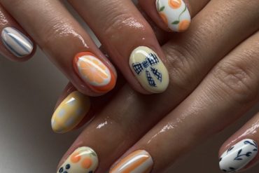 Short oval nails with citrus slices, gingham bows, floral prints, and colorful mix-and-match fruit patterns