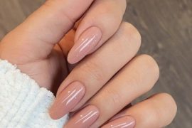 classic nude almond-shaped nails featuring a glossy finish